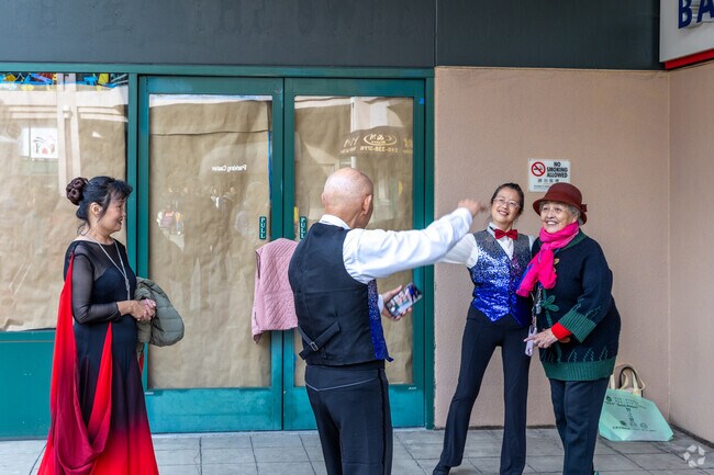 Locals and visitors enjoy each others company at the Lunar New Year Bazaar in Chinatown.