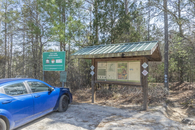 Shealy’s Pond Heritage Preserve offers a peaceful retreat with scenic walking trails and native wildlife.