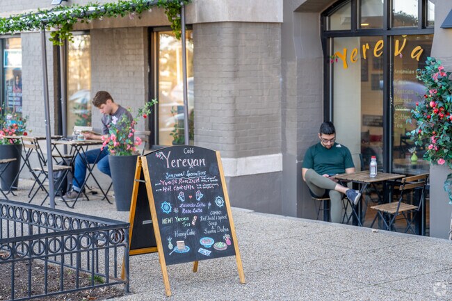 People sitting outside Yerevan Cafe on 18th St in Kalorama Triangle.