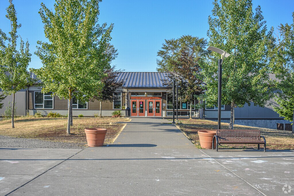A view of the tree-lined entrance to Lakota High School in Federal Way, WA.