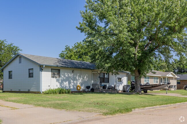 Ranch-style homes with tidy lawns are affordable and common in Sullivan Village.