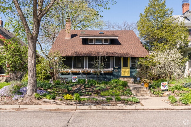 A prairie style home with a flower garden in the South Uptown neighborhood.