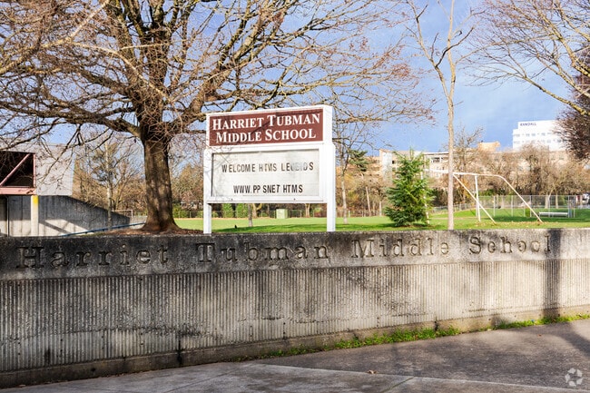 Sidewalk and entrance to Harriet Tubman Middle School.