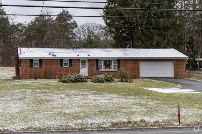 Ranches with attached garages sit in the outskirts of Shade Township.