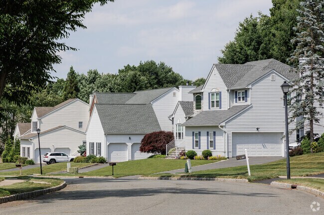 A street is lined with new Colonial Revival style homes Succasunna.