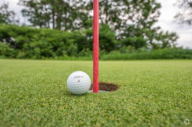 Golfers of West Windsor sink birdie putts on the pristine greens of John P. Larkin Country Club.