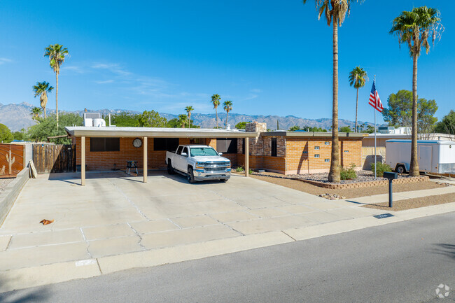 Car ports provide shade for vehicles when garages are not present.