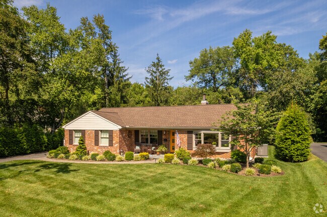Fairfax is home to lovely landscaping like the yard of this ranch home.