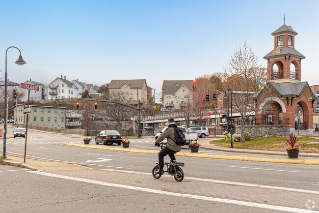 A resident riding an electric bike in downtown Woonsocket.