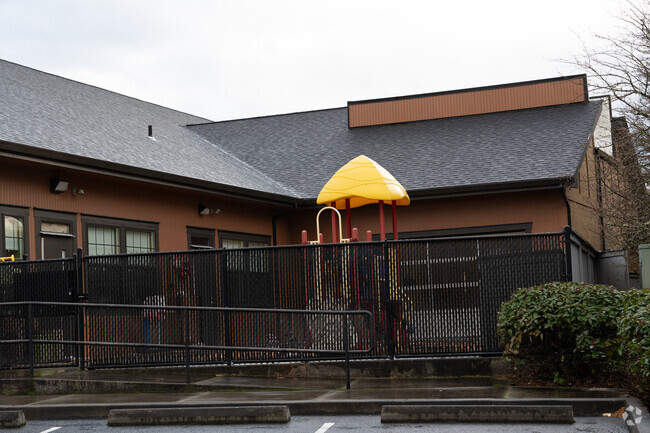 Play structure in the front of Tree Hill Learning Center.