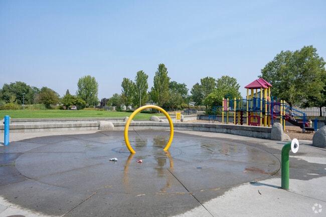 Families in White City gather at local splash pads and playgrounds to cool off and connect outdoors.
