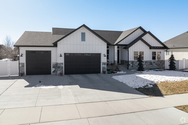 A vinyl home sits on a suburban street in the South Jordan neighborhood.