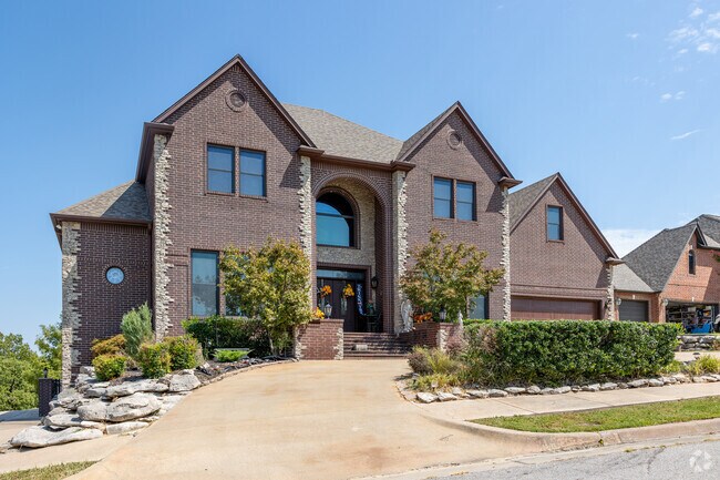 Elegance and charm exude from a French-style home, adding sophistication to Sand Springs.