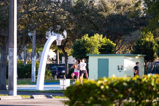 Children play basketball in the Palm Springs North neighborhood.