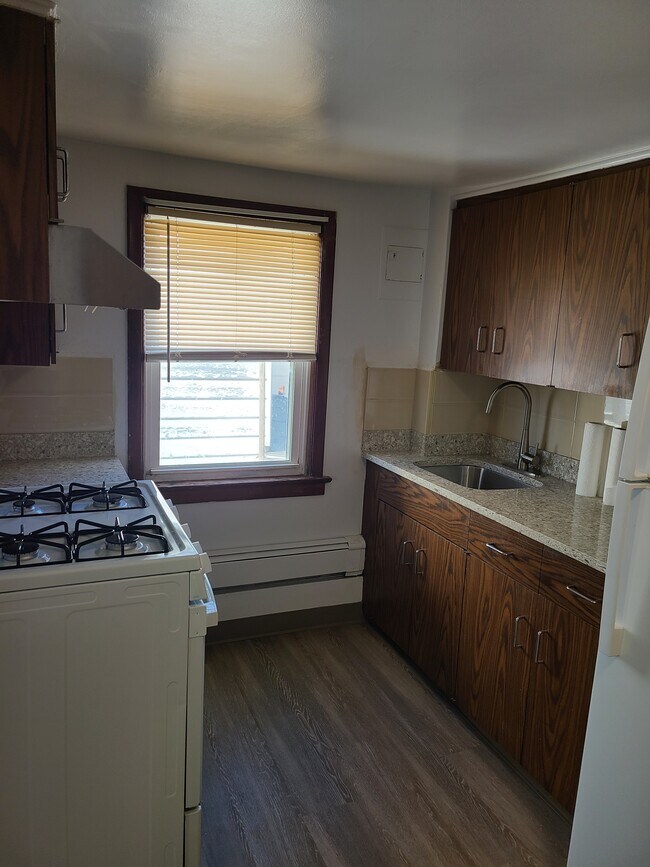 Kitchen with new marble tops, window and fan