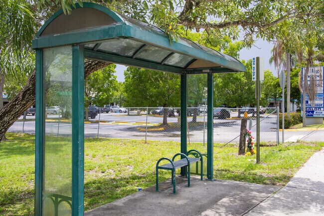A convenient bus stop in La Mancha offers shade and a place to rest for public transit users.