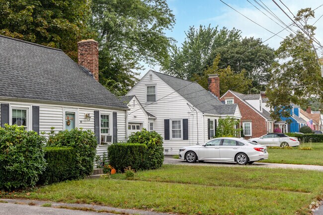 A brilliant row of classic Cape Cod style homes in the Buttonwoods neighborhood is typical.