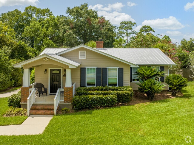 Simple landscaping accents this lovely home.