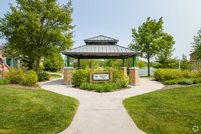 Woodridge's Somerset Park features a playground with slides, swings & climbing structures.