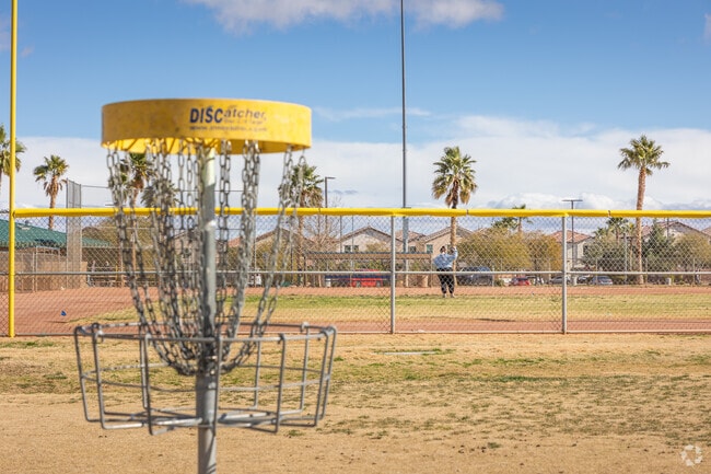 Red Ridge Park welcomes families with baseball fields and a disc golf course in Rhodes Ranch.