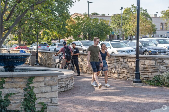 Residents of Signal Point enjoy a sunny day on the Naperville Riverwalk.