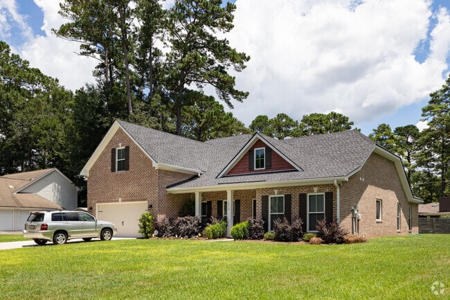 A classic Craftsman-style home stands proudly in Windsor Forest, ready to offer comfort and style.