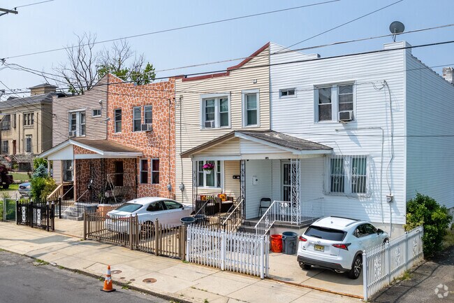Colorful duplexes have small driveways in the Cramer Hill neighborhood.