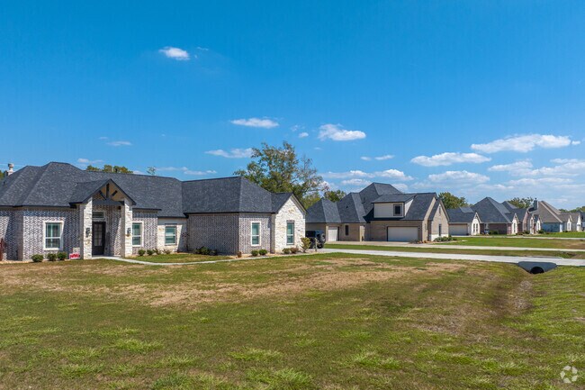Single-story and two-story homes dot the streets of Beach City, Texas.