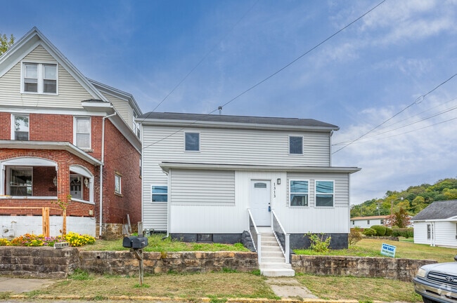 An enclosed porch on a home keeps out the weather in Jerome Park.