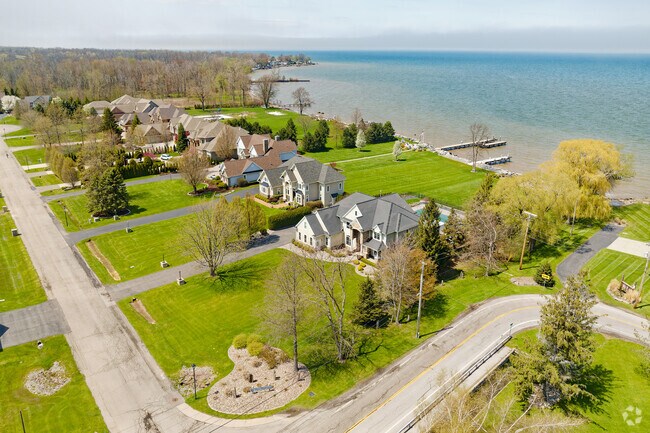 Victorian-style homes on Lake Ontario next to Parma feature private beaches and are priced between $1,500,000 and $1,800,000.