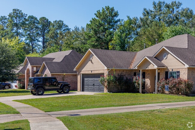 The Pines Road neighborhood features wide, quiet streets surrounded by trees.