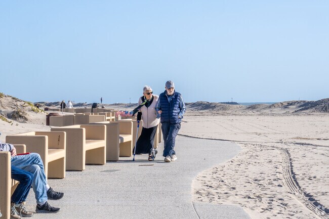 There is a walking path and benches along Oxnard's sandy beaches.