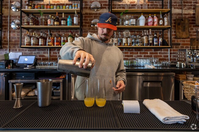 A bartender makes a tasty drink at Folk Art in Hapeville Georgia.