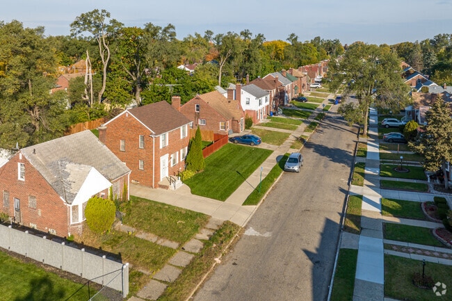 A row of two-story brick homes in the Hubbell-Puritan neighborhood of Detroit, MI.