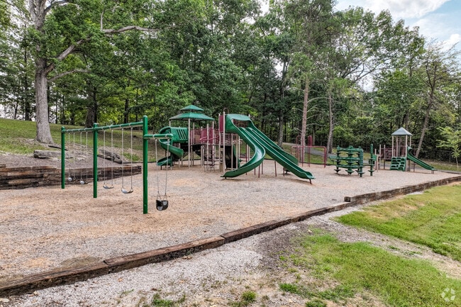Luttrell’s park features a spacious playground for kids to climb, swing, and slide.