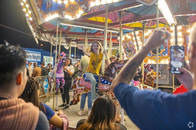 Families enjoy the carnival rides at the annual West Side Nut Club Festival.