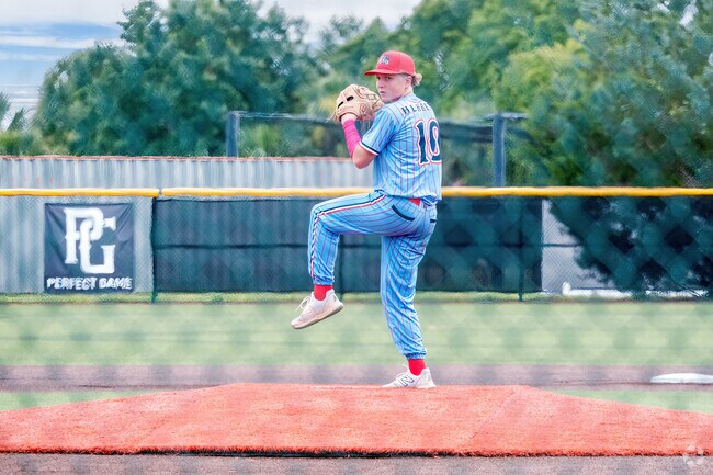 A Beck Hammock resident prepares to pitch at the nearby 100-acre Boombah Sports Complex.