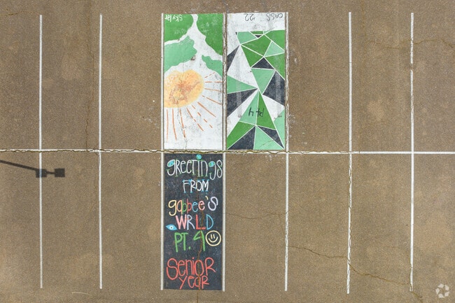 Students show off their art skills in the parking lot at Lake Cormorant High School.