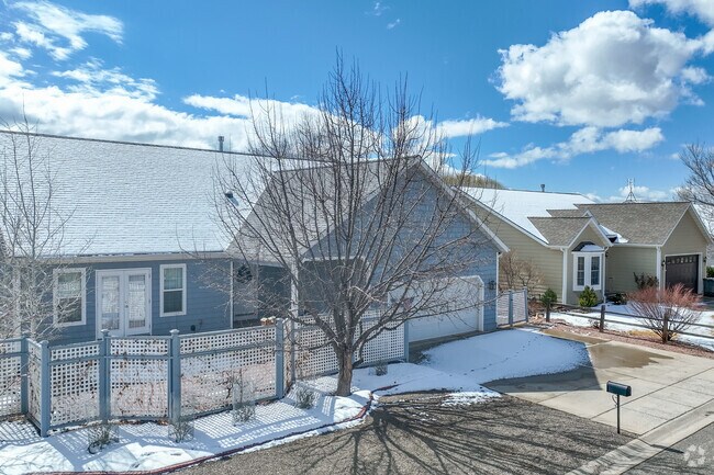 New builds around Cortez include ranch style homes with wood siding.