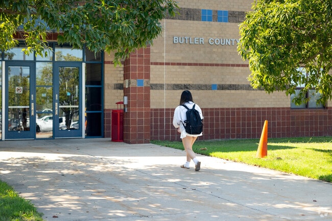 A student arrives at Butler County Community College, which shares a campus with Rose Hill High.