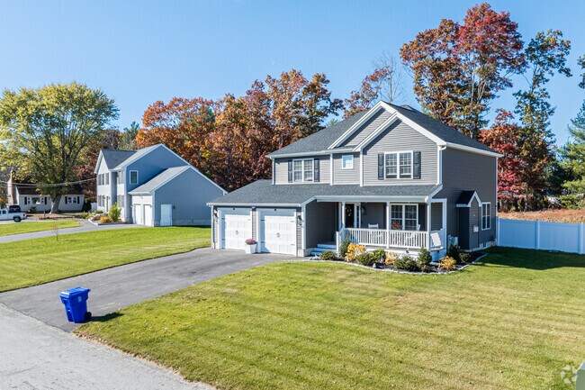 Farmhouses and colonial style homes on large lots in Westville feature well manicured lawns.
