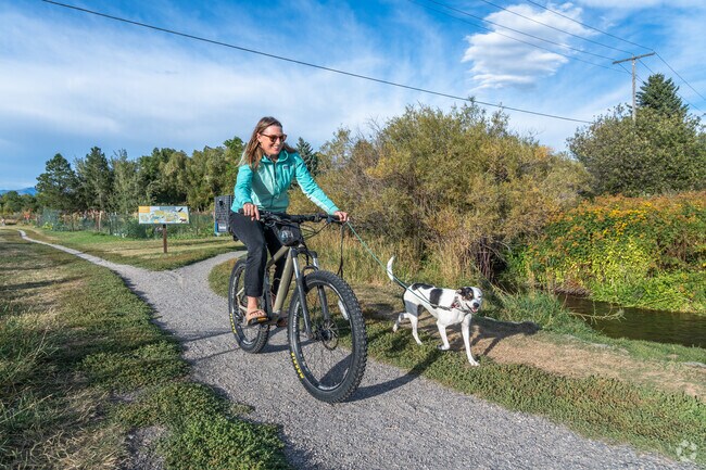 University neighborhood Dog owners are welcome on the trails at Langohr Gardens Park.