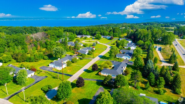Single-story homes line winding streets in a scenic bayfront community in Traverse City.