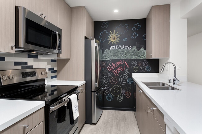 Design Package III Kitchen with hard surface flooring stainless steel appliances