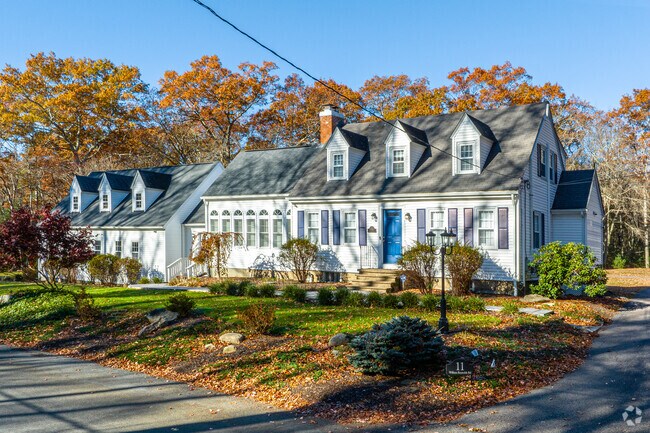 This large cape cod is a jewel, sporting large dormers and two additions.