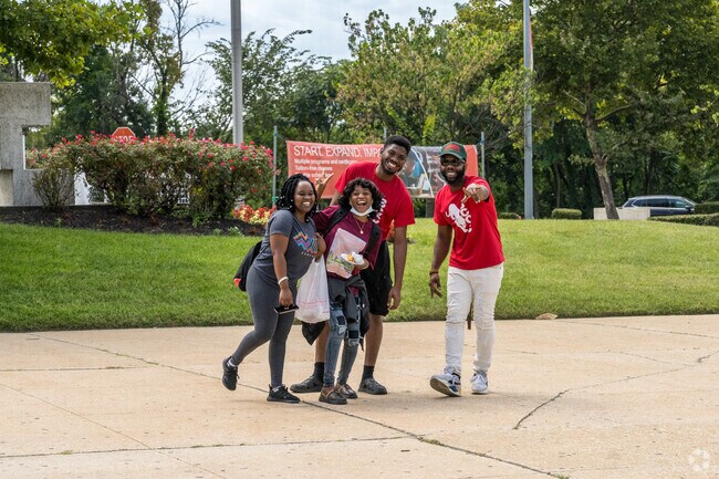 Students at Baltimore City Community College near Ashburton ham it up for the camera.