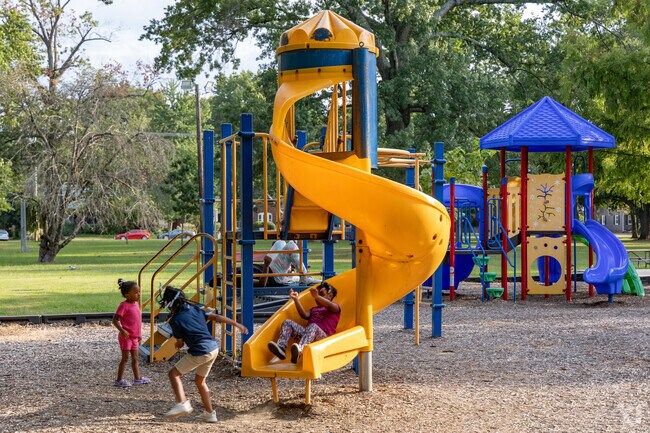 Children enjoy the playground in Akin Park.