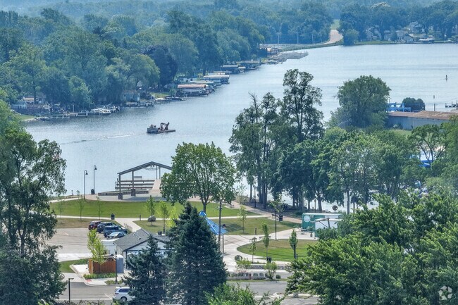 Boaters run the river of McHenry Shores near the Riverwalk Shops.