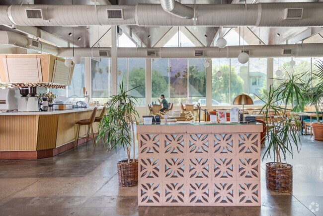 Boozehounds in Racquet Club West features chic mid-century modern décor.