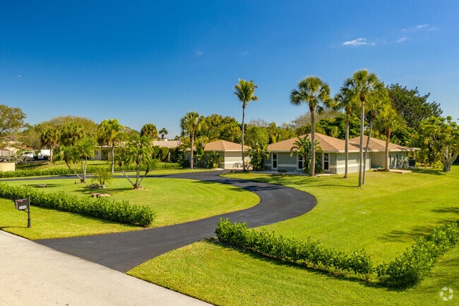 Well-manicured lawns are a frequent sight in the Robbins Park neighborhood.